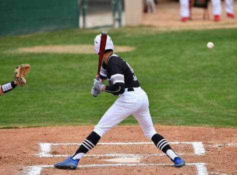 Action photo of high school baseball players making amazing plays during a baseball game