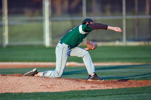 Action photo of high school baseball players making amazing plays during a baseball game