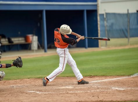 Action photo of high school baseball players making amazing plays during a baseball game