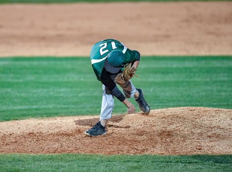 Action photo of high school baseball players making amazing plays during a baseball game