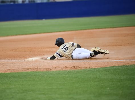 Action photo of high school baseball players making amazing plays during a baseball game