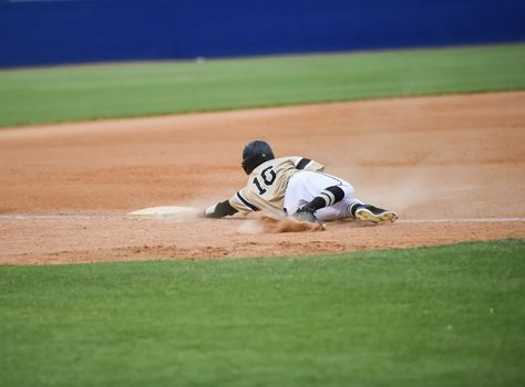 Action photo of high school baseball players making amazing plays during a baseball game