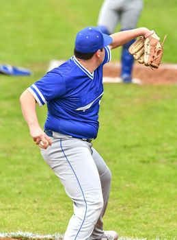 Action photo of high school baseball players making amazing plays during a baseball game