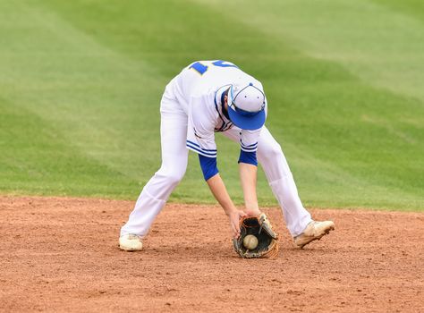 Action photo of high school baseball players making amazing plays during a baseball game