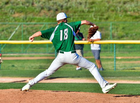 Action photo of high school baseball players making amazing plays during a baseball game