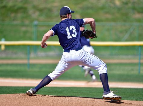 Action photo of high school baseball players making amazing plays during a baseball game