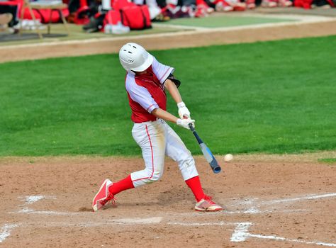 Action photo of high school baseball players making amazing plays during a baseball game