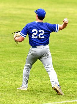 Action photo of high school baseball players making amazing plays during a baseball game