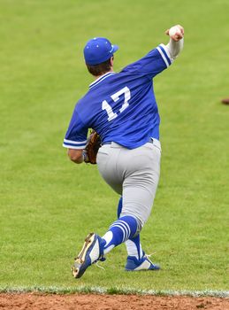 Action photo of high school baseball players making amazing plays during a baseball game