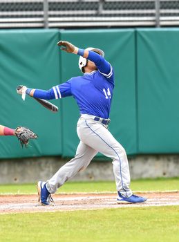 Action photo of high school baseball players making amazing plays during a baseball game