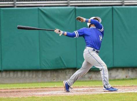 Action photo of high school baseball players making amazing plays during a baseball game