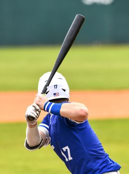 Action photo of high school baseball players making amazing plays during a baseball game