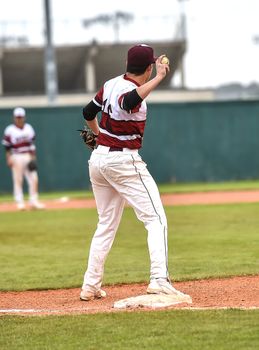 Action photo of high school baseball players making amazing plays during a baseball game