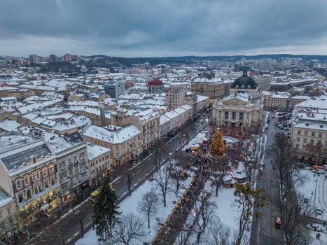 Lviv, Ukraine, December. Arial shot. Lvov Opera house. Christmas tree. Christmas Fair. People are walking around the city center