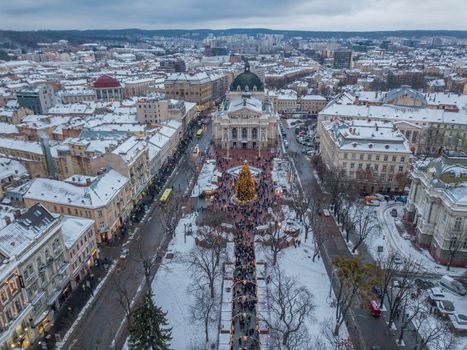 Lviv, Ukraine, December. Arial shot. Lvov Opera house. Christmas tree. Christmas Fair. People are walking around the city center