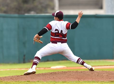 Action photo of high school baseball players making amazing plays during a baseball game