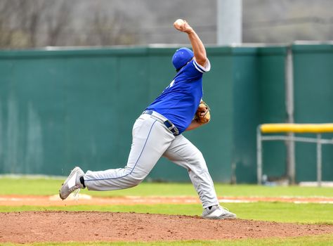 Action photo of high school baseball players making amazing plays during a baseball game