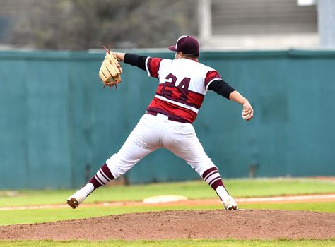 Action photo of high school baseball players making amazing plays during a baseball game