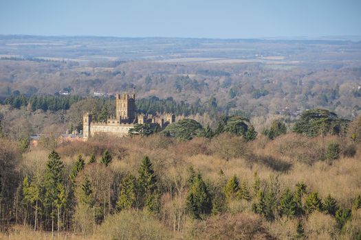 Highclere Castle, the Jacobethan style country seat of the Earl of Carnarvon and location for the period drama television series Downton Abbey, below Beacon Hill, near Newbury, UK