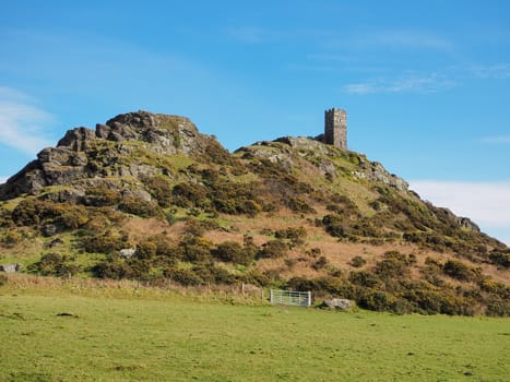 The isolated 13th century church of St Michael de Rupe which sits on top of Brent Tor, an old weathered volcano, Dartmoor National Park, Devon, UK