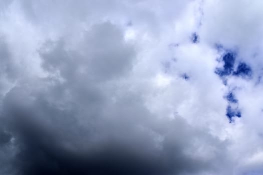 Beautiful fluffy white beautiful cloud formations in a deep blue summer sky