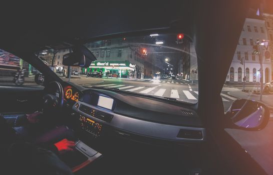 Vienna Austria March.22 2019, Young Men driving his BMW car waiting on traffic lights