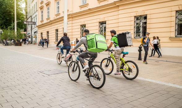 Vienna Austria May.25 2018, Uber Eats is an International food delivery company from U.S, Cyclist caring backpacks
