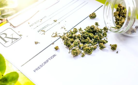 Container with medical Marihuana on Doctor prescription receipt