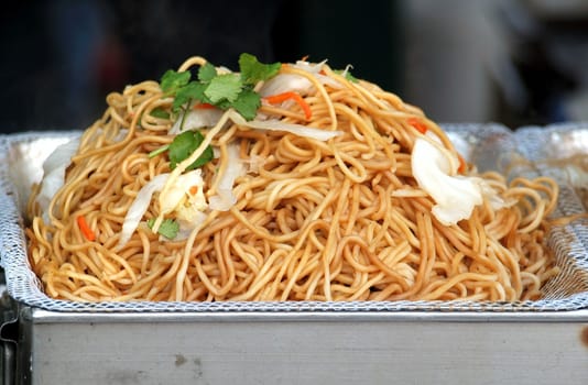 Fried noodles with cabbage and parsley, a common Chinese dish
