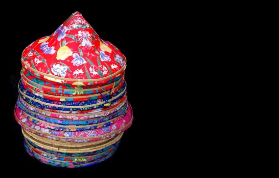 Traditional Chinese straw hats covered with colorful cloth