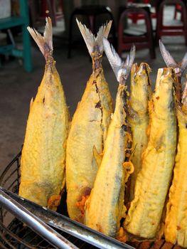 -- whole fish in batter at an outdoor Chinese restaurant
