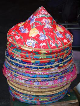 Traditional Chinese straw hats covered with colorful cloth
