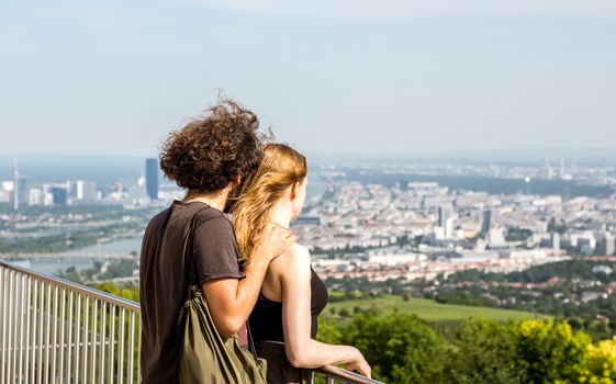 Vienna Austria May.30 2018, Millennial couple looking down the City of Vienna from the Kahlenberg mountain