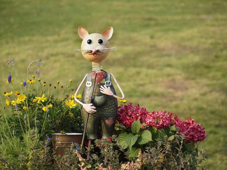 A self-made garden gnome in the shape of a mouse
