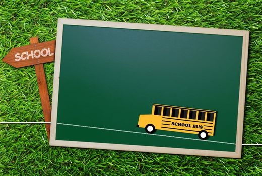 Education concept, knowledge management, back to school, paper cut yellow bus on green grass background