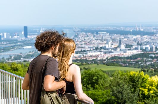 Vienna Austria May.30 2018, Millennial couple looking down the City of Vienna from the Kahlenberg mountain