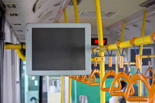 Handles and monitor for standing passenger inside a bus