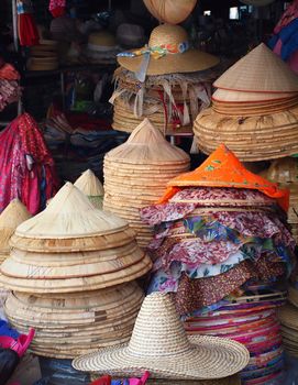 Handmade strawhats with colorful cloth are displayed at a market in Taiwan