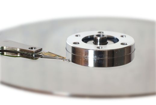 Macro image of a hard disk platter, spindle and head
