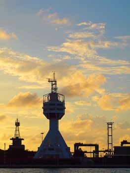 The control tower guarding the entrance to Kaohsiung port at dusk
