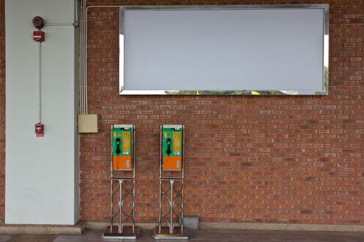The roll of colorful public phones in the railway station