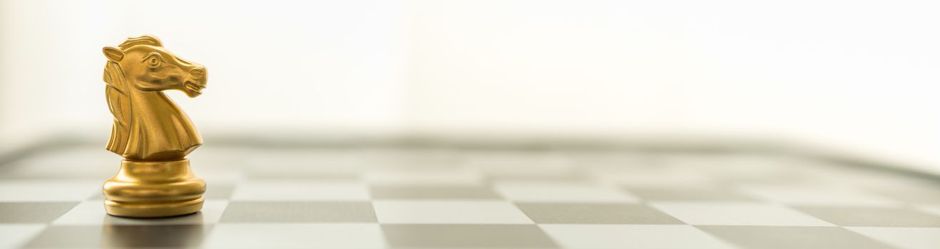 Sport board game, Business and Planning Cover Concept. Closeup of knight chess piece on chessboard with copy space.