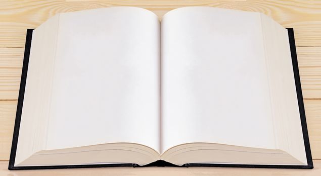 Book on wood background, education concept