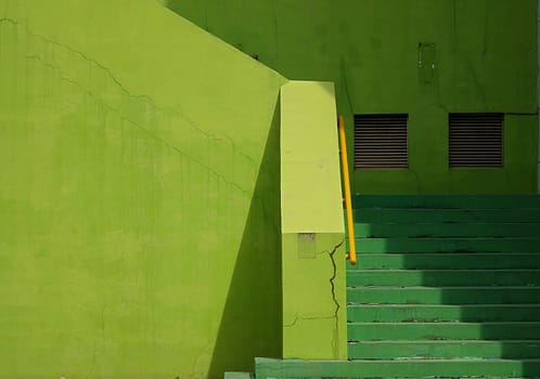 Architectural elements in various shades of green form an abstract image