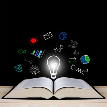 Knowledge management concept, open book on blackboard, copy space