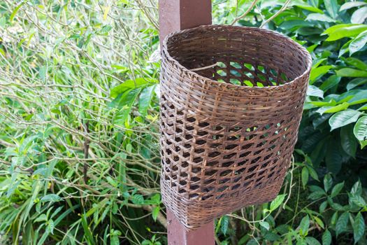 Bamboo trash basket in garden