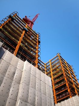 The massive steel frame of a modern building construction site