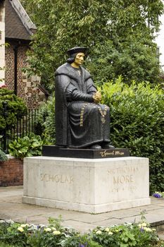 Statue of the Tudor politician Sir Thomas More (1478 - 1535) considered by Catholics to be a Saint. Chelsea Embankment, London. Sculpted by L Cubit Bevis, erected 1969.