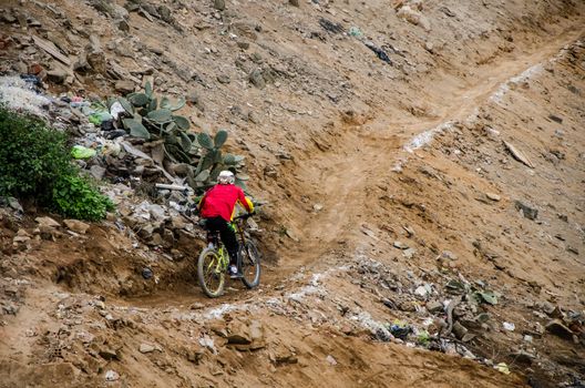 A cyclist practicing Downhill from the top of the Hill