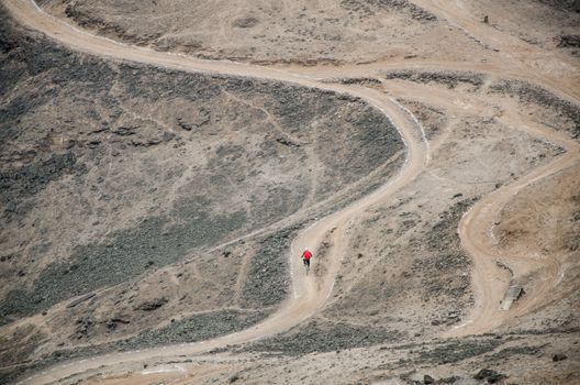 A cyclist practicing Downhill from the top of the Hill